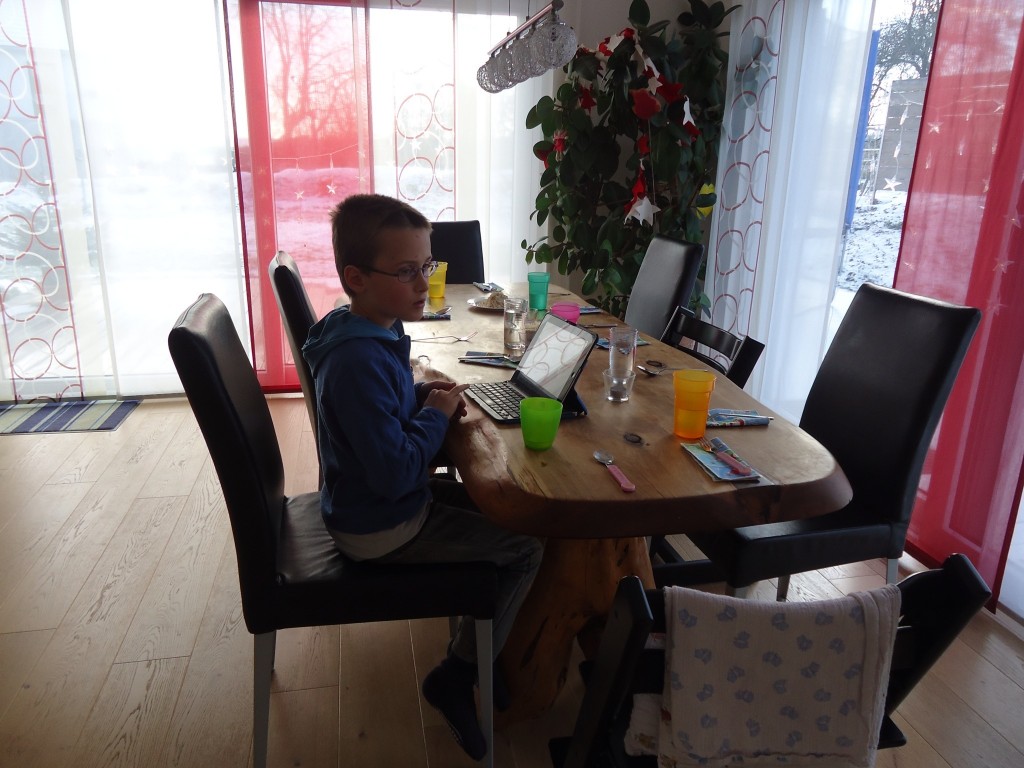 Ben working at Pascale's kitchen table.