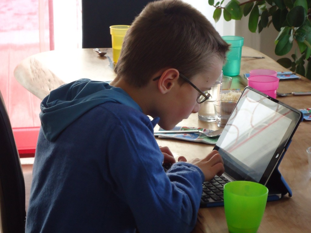 Ben fully focused on his writing.