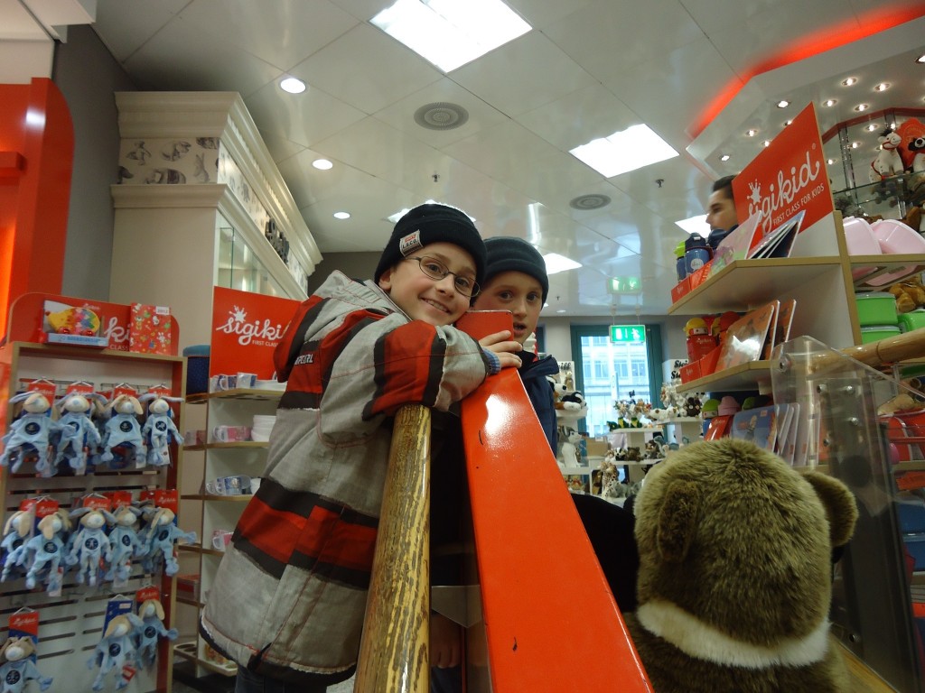 Ben and Nick looking down from the first floor.  Next to the steps going down is a ladder, but perhaps because of the busy Christmas period the wooden slide was out of action with balls and toys placed on it so it couldn't be used.