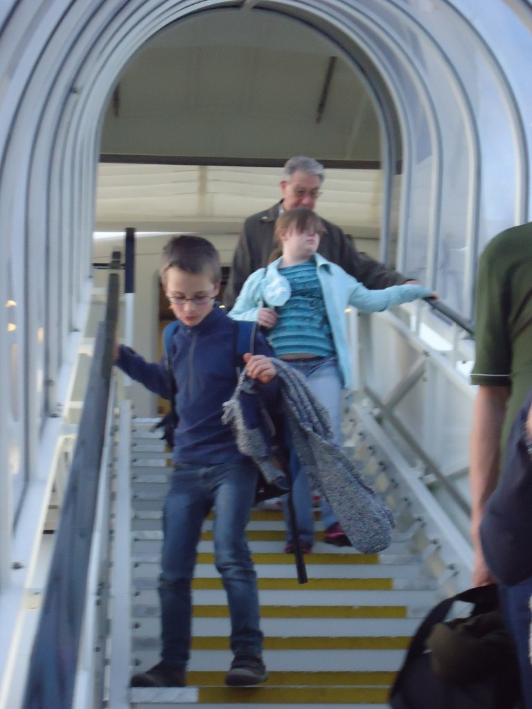 Ben coming down the stairs from the plane.