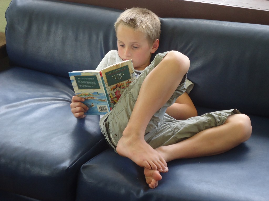 Nick relaxing with a book he found at the house.