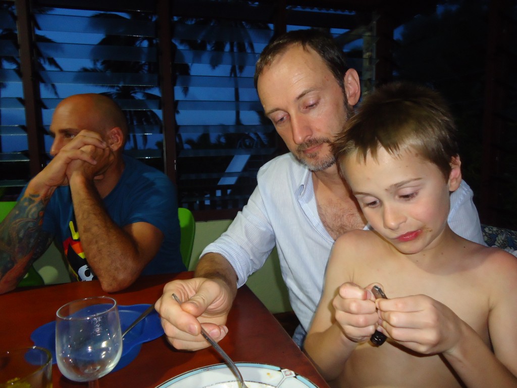 Oh Dad, this thing her in my hand is sooo much more interesting than eating dinner.