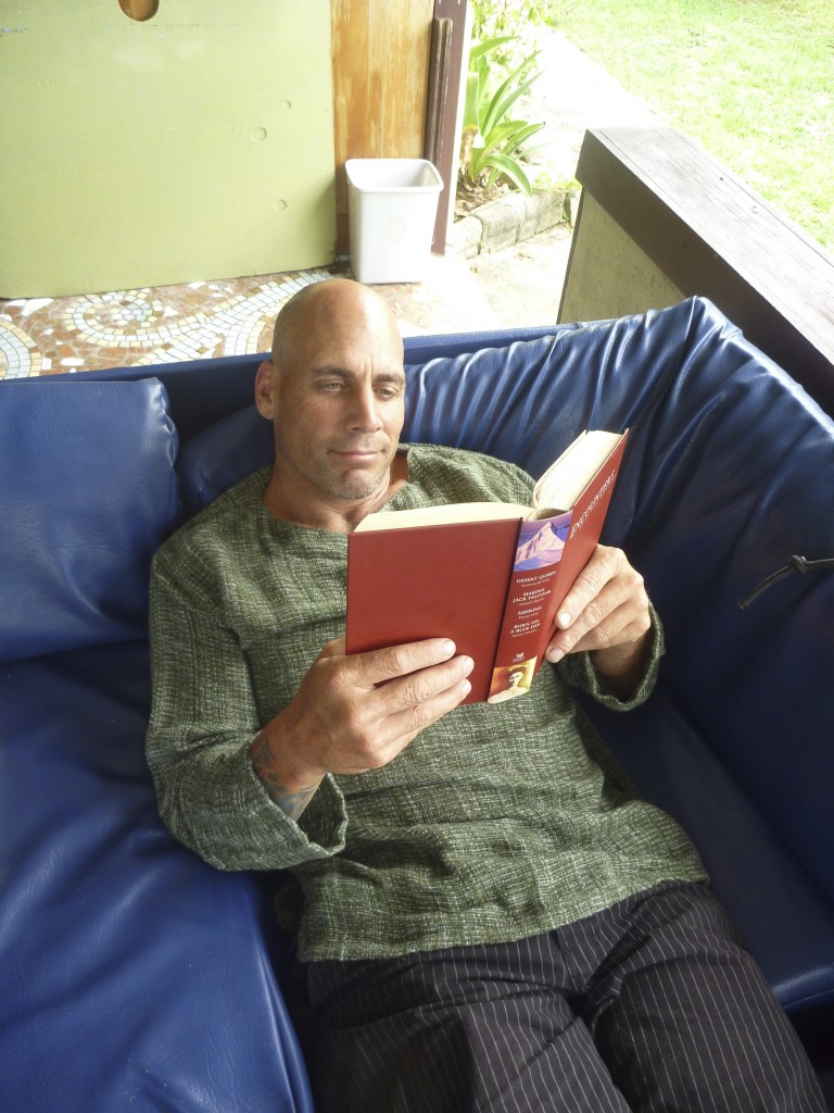 Chris relaxing with a book that he had found at the house, too.