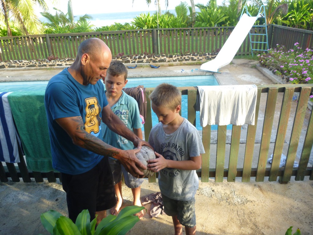 Chris discussing coconut husks  with Dom and Nick.