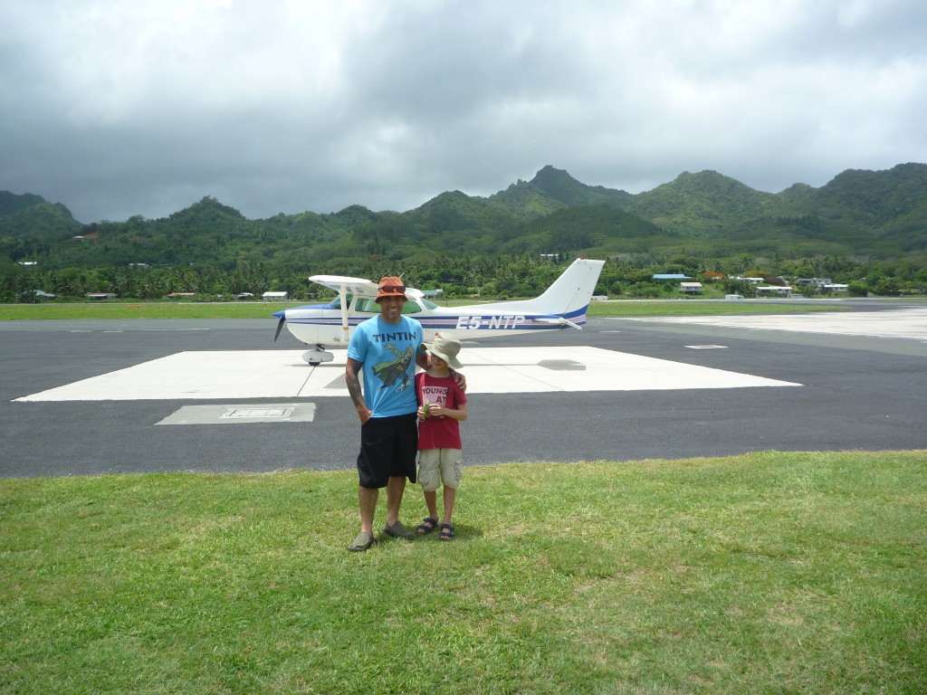 Uncle Chris and I in front of our plane we are about to board.